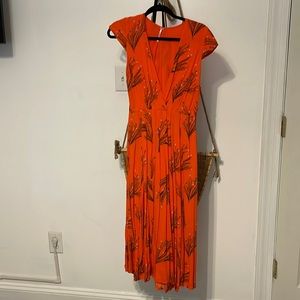 Free people midi dress with deep v neck line.